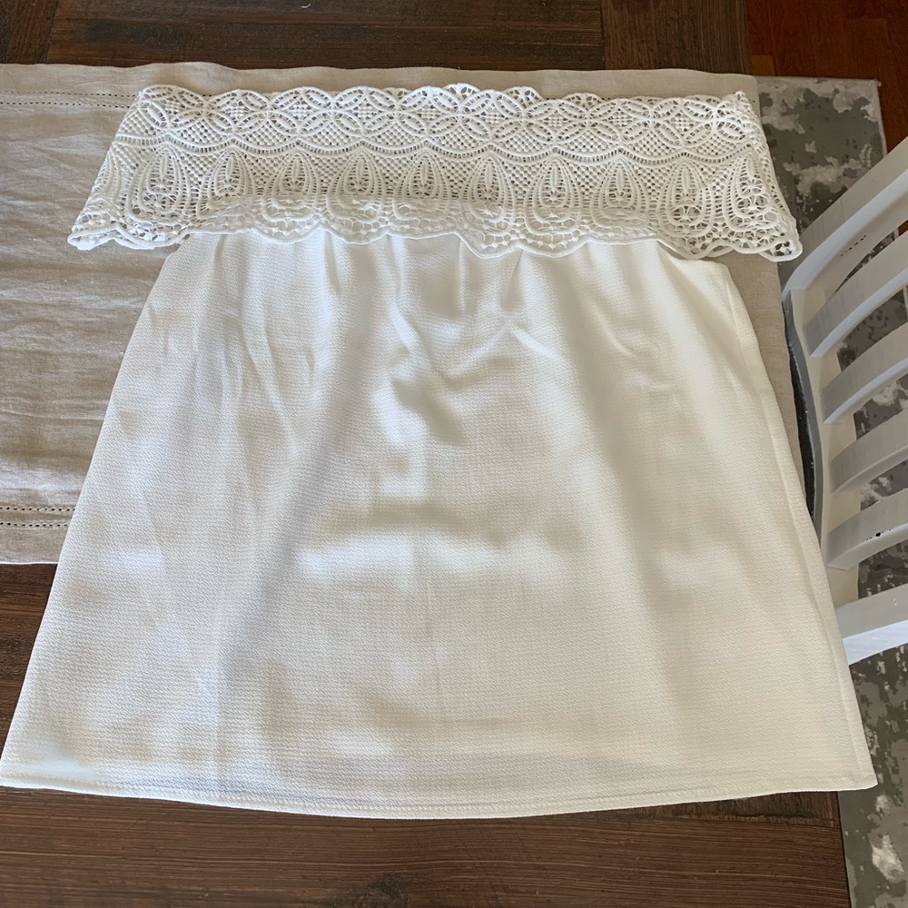 White off the shoulder blouse with lace detail.